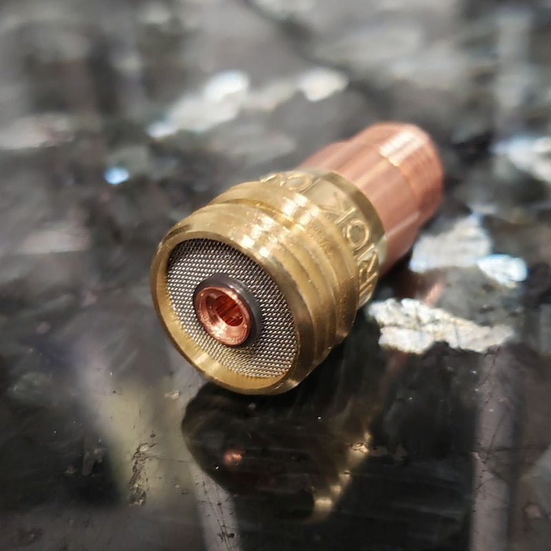 stubby gas lens laying sideways to show the mesh and hole for tungsten