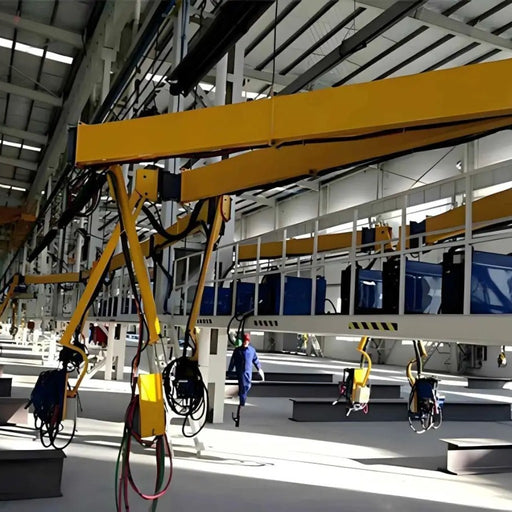 a series of column mounted welding booms in a factory
