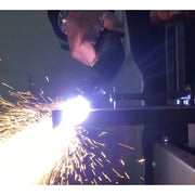 action shot of plasma cutting a thick steel plate with intellicut bevel guide