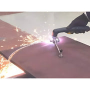 action shot with sparks flying while plasma torch cuts a circular bevel