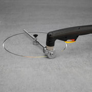 action shot of a plasma torch at the end of cutting a circle out of sheet metal
