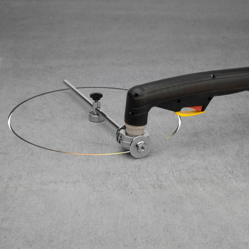 action shot of a plasma torch at the end of cutting a circle out of sheet metal
