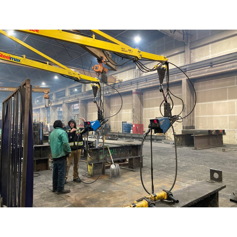 side by side wire feeder booms with miller wire feeders attached