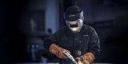 man laser welding while wearing tecmen 100lw laser welding helmet