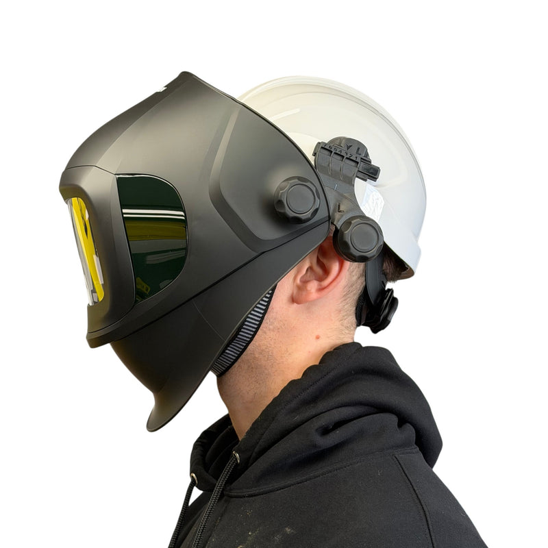 man wearing welding helmet and hard hat with flip front closed