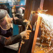 Man cutting steel with Victor Cutting Torch