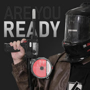 marketing image of a welder holding yeswelder spool gun with helmet on
