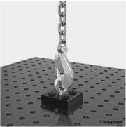 crane attached to shipping bracket that is attached to siegmund system 16 welding table