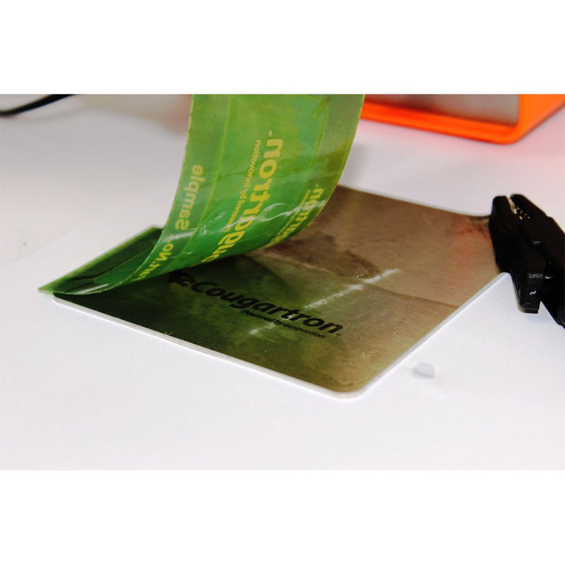 cougartron stencil peeling off stainless steel showing cougartron logo imprinted in metal