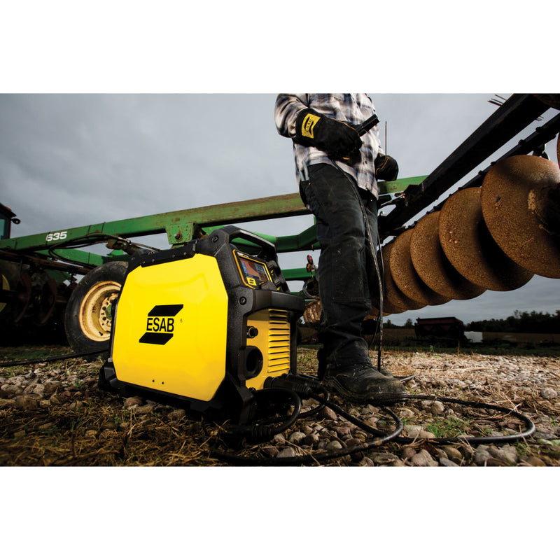 action shot of stick welding on agricultural equipment using esab rebel emp 205ic multiprocess welder