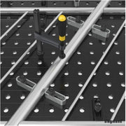 close up of siegmund flex stops being used to hold railing in place on welding table