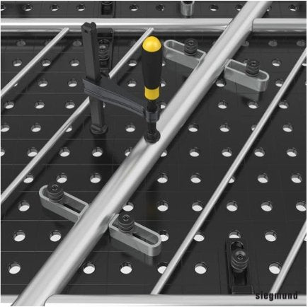 close up of siegmund flex stops being used to hold railing in place on welding table